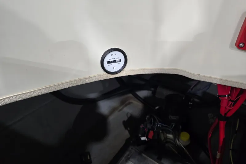 Slide: The Image of Hour meter on 2014 Larson All American 23 boat dashboard. - 36