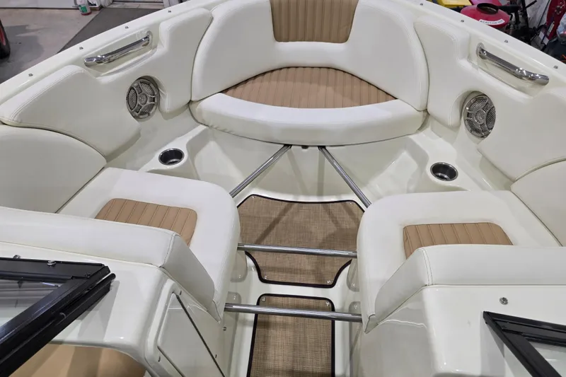 Slide: The Image of Interior of 2014 Larson All American 23 boat with white and tan seating. - 39