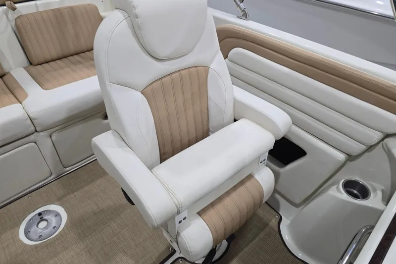 Slide: The Image of 2014 Larson All American 23 boat interior with beige and white seating. - 49