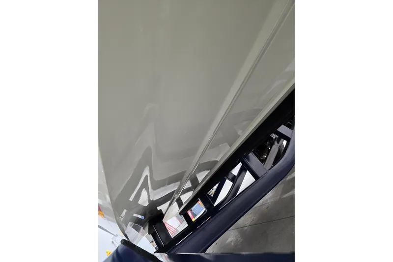 Slide: The Image of 2014 Larson All American 23 boat hull on trailer, close-up view. - 66