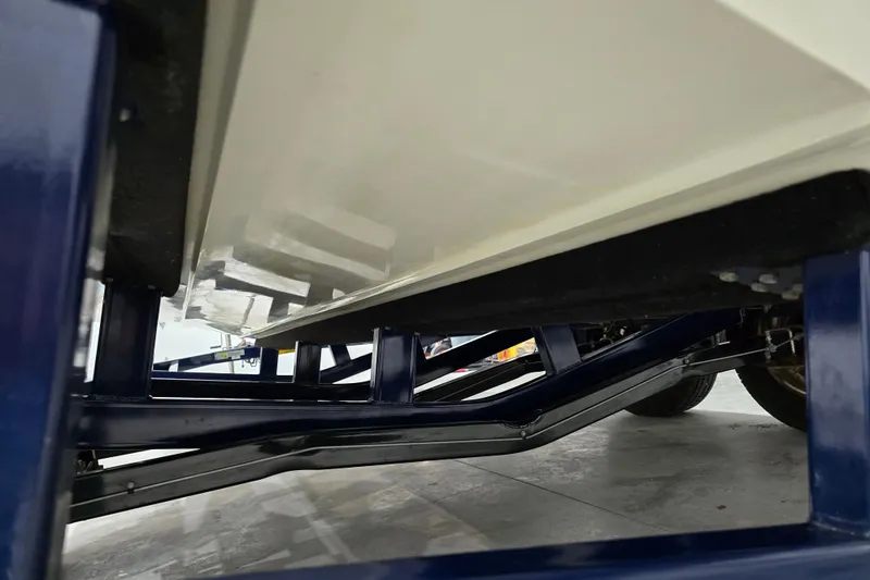 Slide: The Image of Underside view of 2014 Larson All American 23 boat on a trailer. - 67