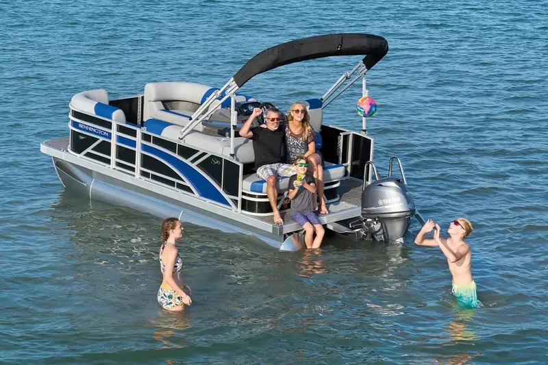 The Image of 2026 Bennington S 20 SSR pontoon boat with people enjoying water activities. - 1