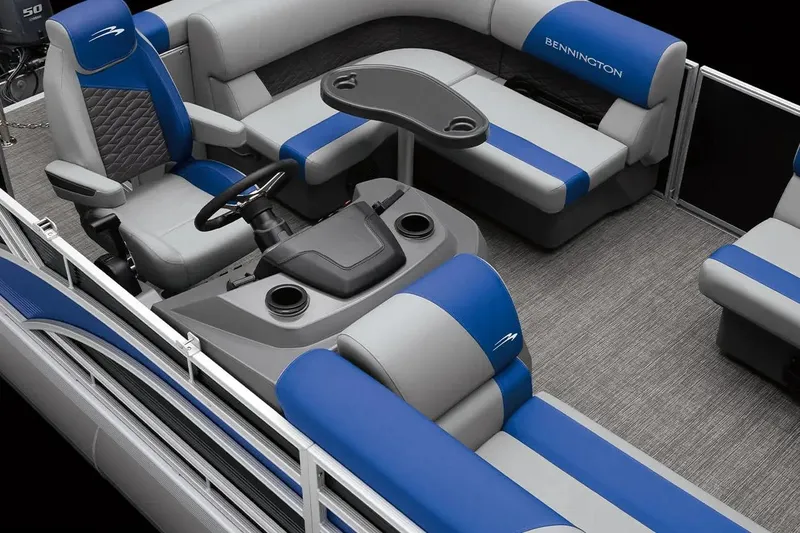 Slide: The Image of 2026 Bennington S 20 SSR pontoon boat interior with blue and gray seating and steering console. - 3
