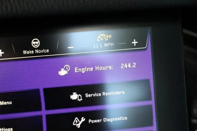 Slide: The Image of Display screen of 2022 Nautique Super Air Nautique S23 showing engine hours and diagnostics. - 15