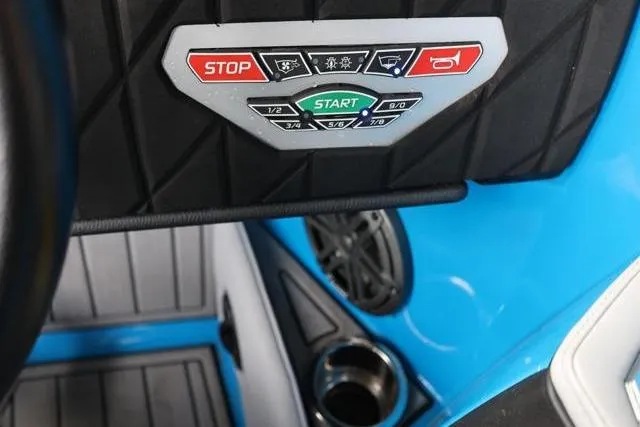Slide: The Image of Control panel of 2022 Nautique Super Air Nautique S23 boat with start and stop buttons. - 20