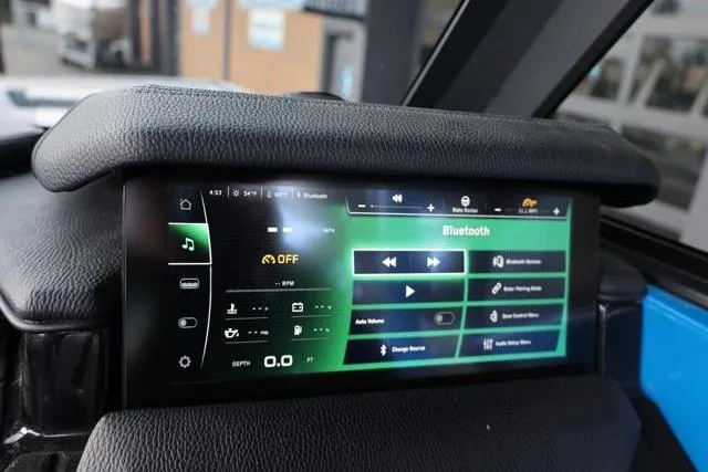 Slide: The Image of 2022 Nautique Super Air Nautique S23 dashboard with touchscreen controls and Bluetooth connectivity. - 21