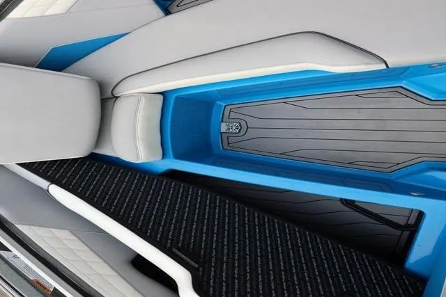 Slide: The Image of Interior of 2022 Nautique Super Air Nautique S23 boat with blue and gray seating. - 23