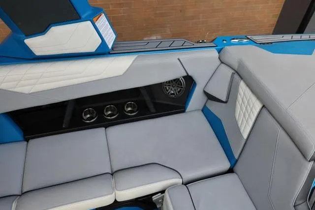 Slide: The Image of Interior of 2022 Nautique Super Air Nautique S23 boat with blue and gray seating. - 38