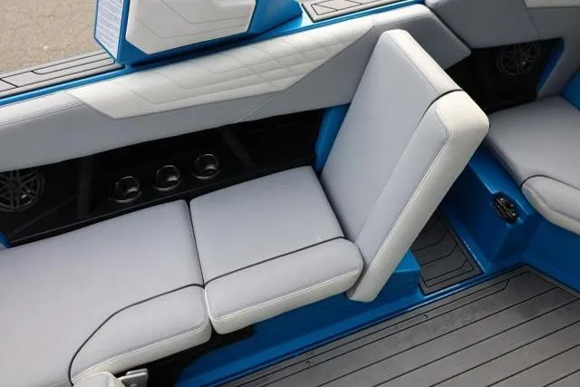 Slide: The Image of 2022 Nautique Super Air Nautique S23 interior with gray and blue seating. - 40