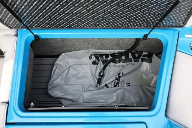 Slide: The Image of Open storage compartment in 2022 Nautique Super Air Nautique S23 boat. - 46