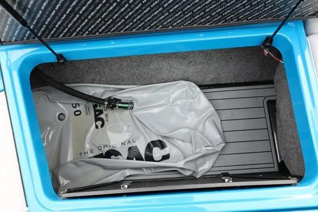 Slide: The Image of 2022 Nautique Super Air Nautique S23 ballast compartment with ballast bag. - 49