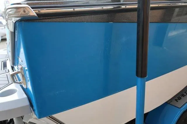 Slide: The Image of 2022 Nautique Super Air Nautique S23, blue and white boat exterior detail. - 60