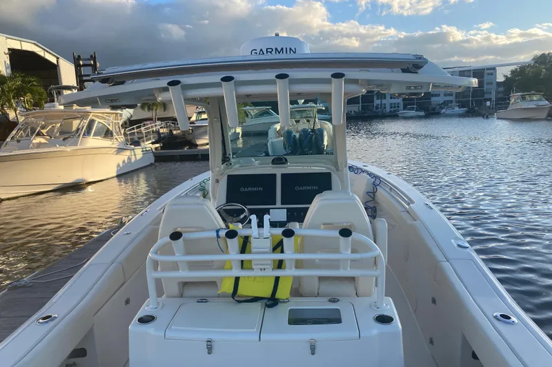 Slide: The Image of 2025 Grady-White Canyon 306 boat interior with luxurious seating and controls. - 10
