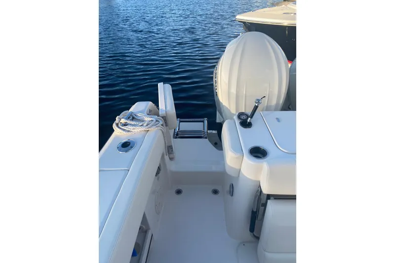 Slide: The Image of 2025 Grady-White Canyon 306 boat docked, showcasing spacious deck and seating. - 14