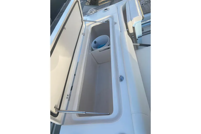 Slide: The Image of 2025 Grady-White Canyon 306 boat with dual engines docked at marina. - 17