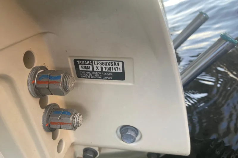 Slide: The Image of 2025 Grady-White Canyon 306 boat with dual Yamaha outboard engines on water. - 20