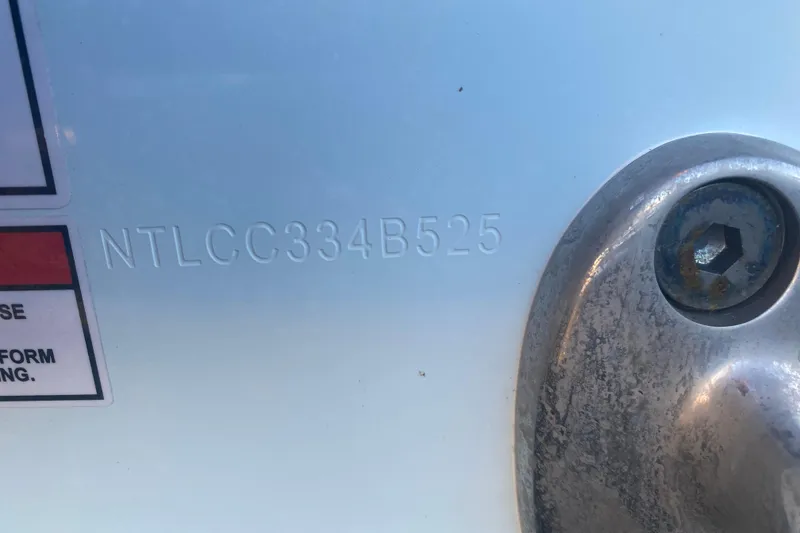 Slide: The Image of Close-up of 2025 Grady-White Canyon 306 boat engine mount near water. - 22