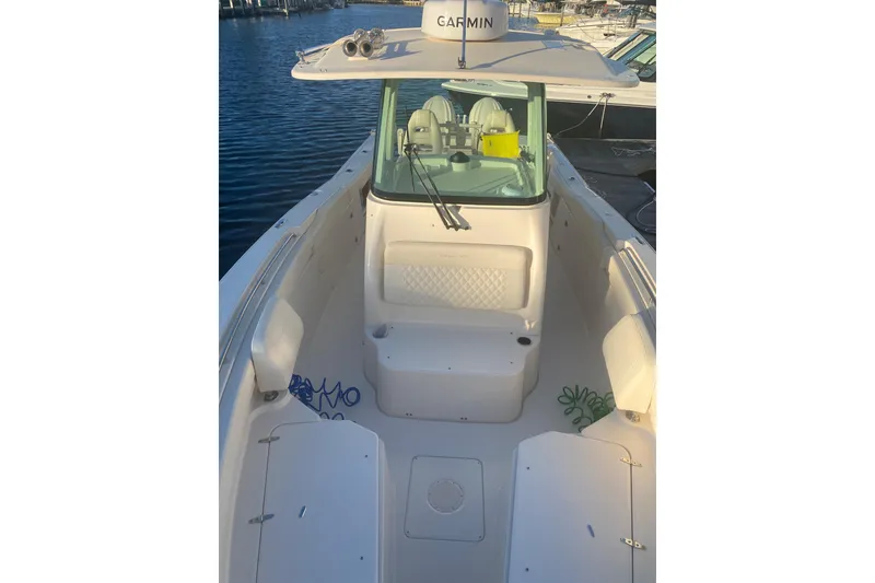 Slide: The Image of 2025 Grady-White Canyon 306 boat interior with open storage compartments. - 3