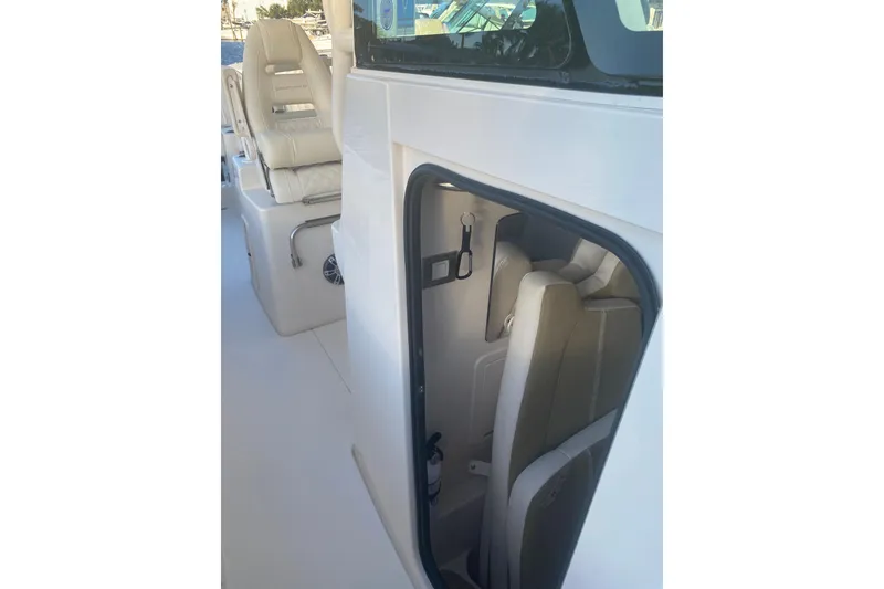 Slide: The Image of 2025 Grady-White Canyon 306 boat interior with Garmin equipment, docked at marina. - 4