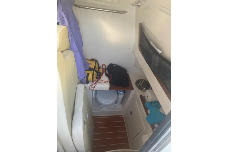 Slide: The Image of 2025 Grady-White Canyon 306 boat interior with seating and storage area. - 5