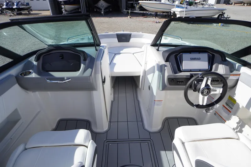 Slide: The Image of 2026 Chaparral 23 SSi OB boat interior with modern dashboard and seating. - 19