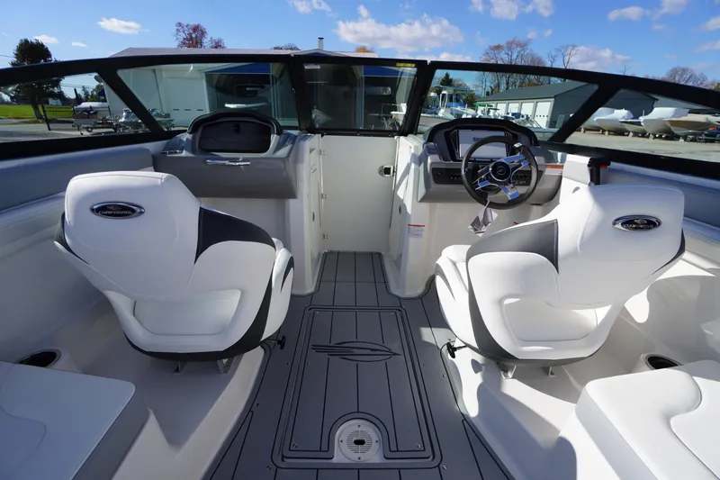 Slide: The Image of Interior of 2026 Chaparral 23 SSi OB boat with modern seating and steering console. - 33