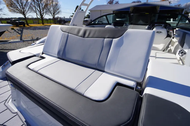 Slide: The Image of 2026 Chaparral 23 SSi OB boat interior with sleek, modern seating design. - 59