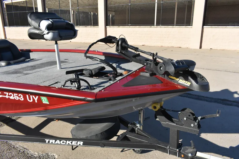 Slide: The Image of 2019 Tracker Pro Team 195 TXW Tournament Edition boat on trailer, featuring a trolling motor. - 10