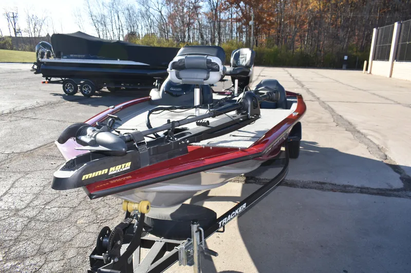 Slide: The Image of 2019 Tracker Pro Team 195 TXW Tournament Edition boat with Minn Kota motor in parking lot. - 11