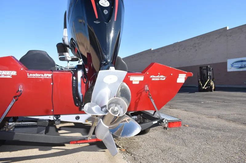 Slide: The Image of 2019 Tracker Pro Team 195 TXW Tournament Edition boat with shiny propeller and red accents. - 15