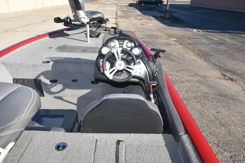 Slide: The Image of 2019 Tracker Pro Team 195 TXW Tournament Edition boat interior with steering wheel and seating. - 16
