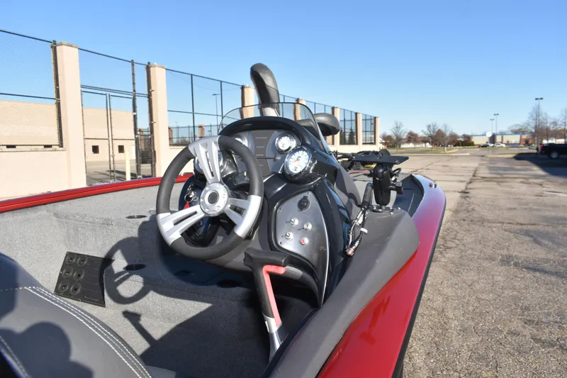 Slide: The Image of 2019 Tracker Pro Team 195 TXW Tournament Edition boat dashboard in a parking lot. - 27