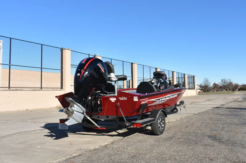 Slide: The Image of 2019 Tracker Pro Team 195 TXW Tournament Edition boat on trailer, parked outdoors. - 3