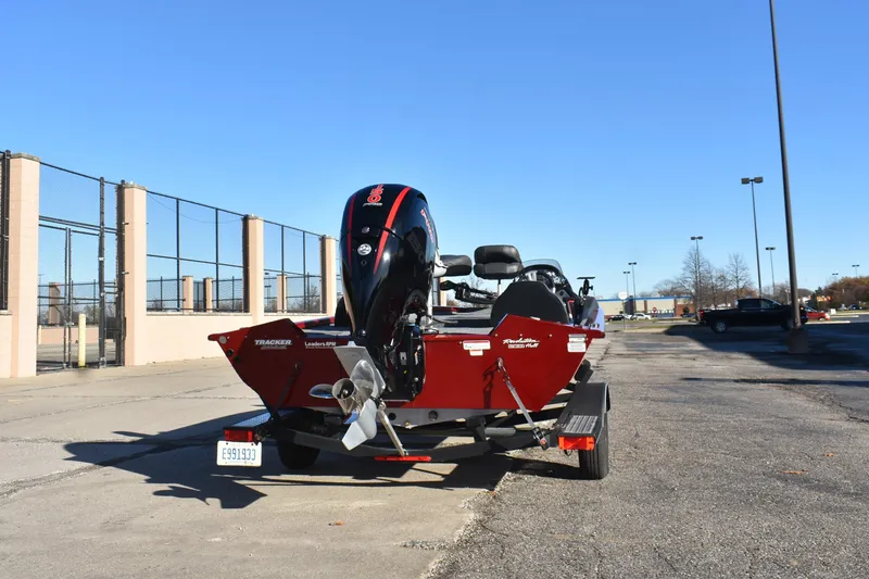 Slide: The Image of 2019 Tracker Pro Team 195 TXW Tournament Edition boat on trailer in parking lot. - 4