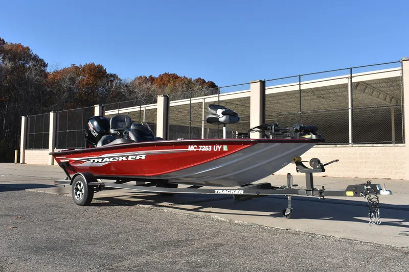 Slide: The Image of 2019 Tracker Pro Team 195 TXW Tournament Edition boat on trailer, parked outdoors. - 7