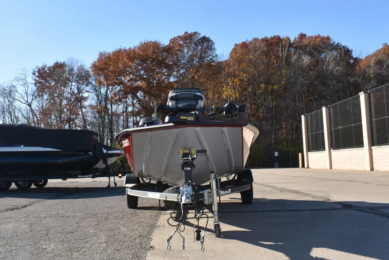 Slide: The Image of 2019 Tracker Pro Team 195 TXW Tournament Edition boat on trailer, autumn background. - 9