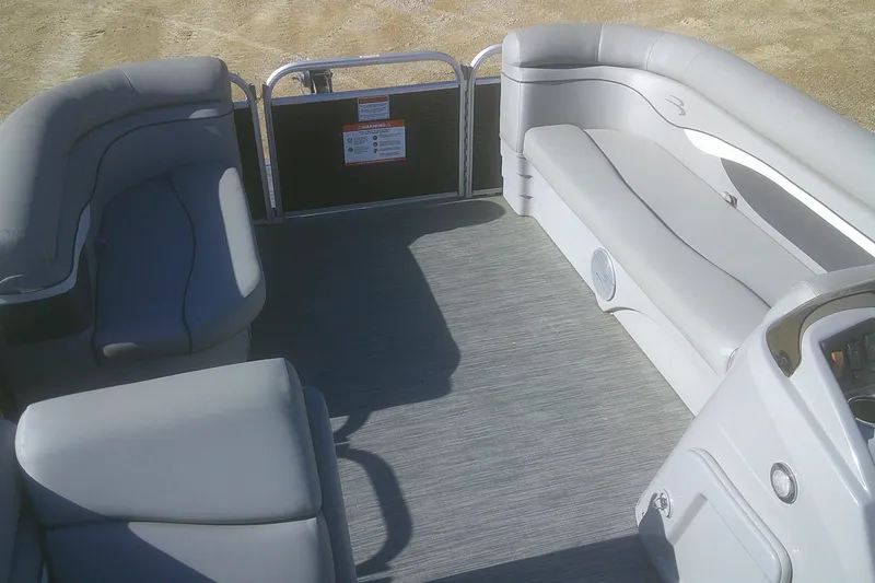 Slide: The Image of 2021 Bennington S 20 L-Bench pontoon boat interior with gray seating. - 15