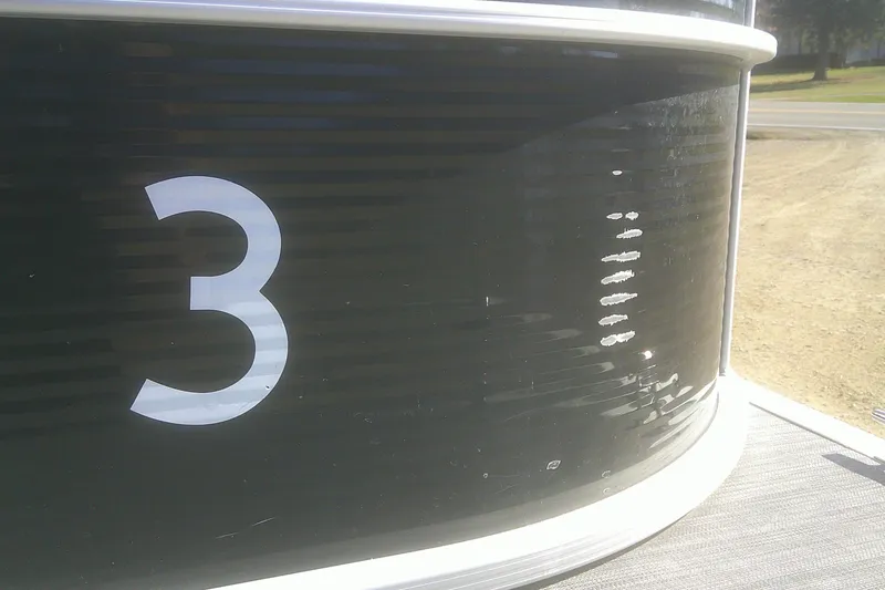 Slide: The Image of Close-up of 2021 Bennington S 20 L-Bench pontoon boat with number three. - 16