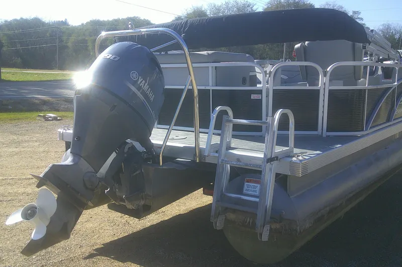 Slide: The Image of 2021 Bennington S 20 L-Bench pontoon boat with Yamaha outboard motor. - 17