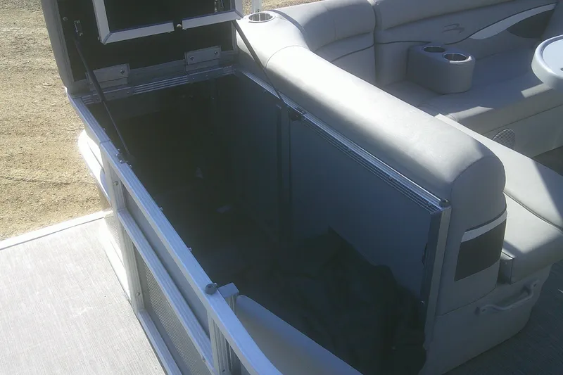 Slide: The Image of 2021 Bennington S 20 L-Bench boat interior with open storage compartment. - 8