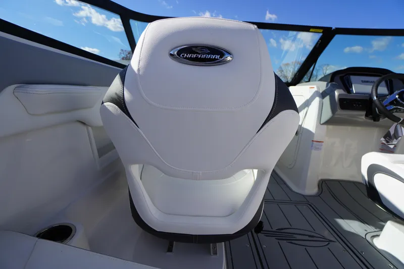Slide: The Image of 2026 Chaparral 23 SSi OB boat interior with white seating and modern dashboard. - 34