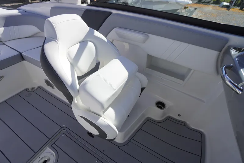 Slide: The Image of 2026 Chaparral 23 SSi OB boat interior with white seating and sleek design. - 37
