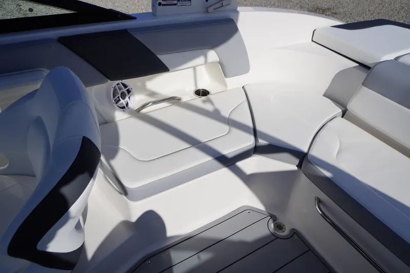 Slide: The Image of 2026 Chaparral 23 SSi OB boat interior with white seating and speaker. - 41