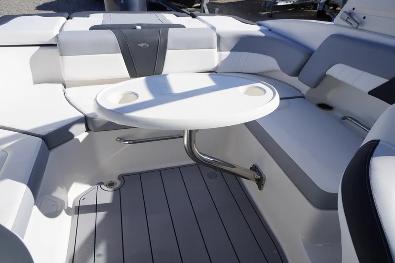 Slide: The Image of 2026 Chaparral 23 SSi OB boat interior with seating and round table. - 48