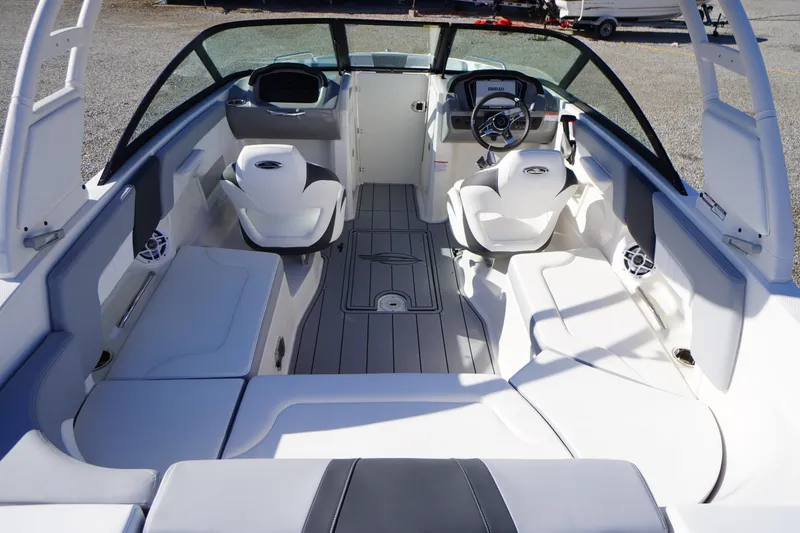 Slide: The Image of 2026 Chaparral 23 SSi OB boat interior with modern seating and steering console. - 53
