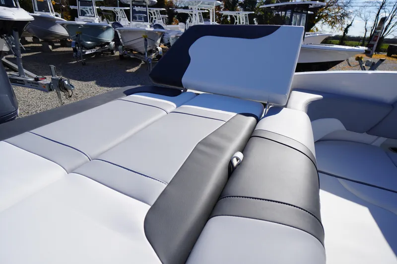 Slide: The Image of 2026 Chaparral 23 SSi OB boat interior with sleek, modern seating design. - 58