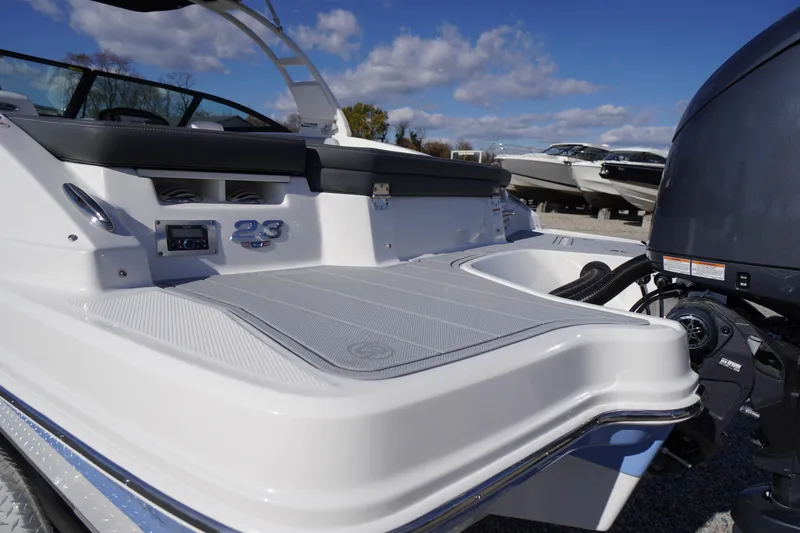 Slide: The Image of 2026 Chaparral 23 SSi OB boat with sleek design and powerful outboard motor. - 62