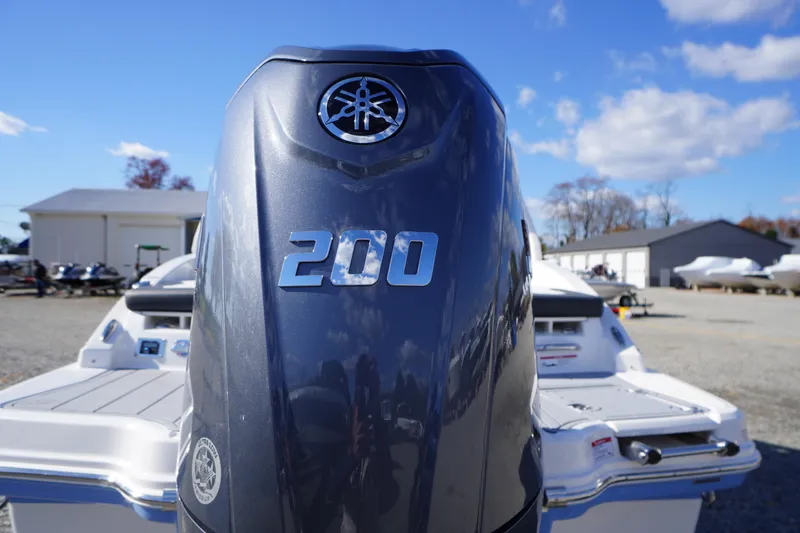 Slide: The Image of 2026 Chaparral 23 SSi OB boat with Yamaha 200 outboard engine, outdoor setting. - 66