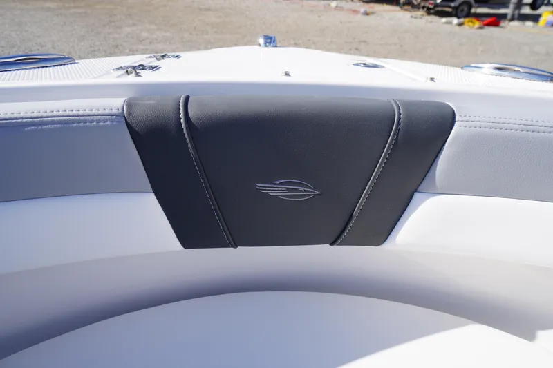 Slide: The Image of 2026 Chaparral 23 SSi OB boat interior with sleek seating and logo detail. - 7