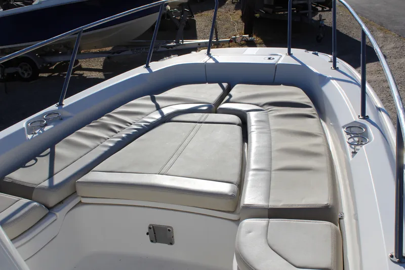 Slide: The Image of 2020 Boston Whaler 240 Dauntless boat interior with cushioned seating. - 13